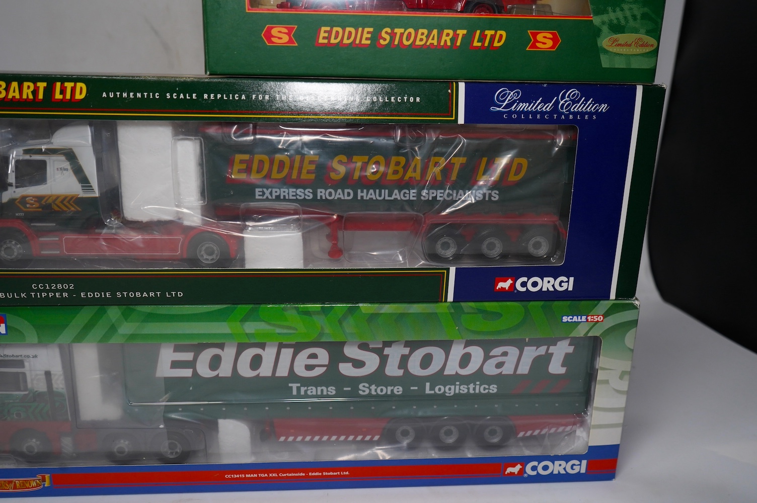 Thirteen boxed diecast Corgi Eddie Stobart commercial vehicles, including; tractor and trailer units, a Scammell Contractor Wrecker, flatbed lorries, curtainside lorries, etc. Condition - good.